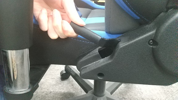 The gaming chair can be reclined by pulling the lever to the end and putting your weight on it, as shown in the image.